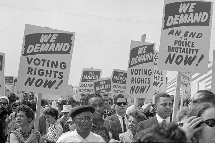 Protesters in the 1963 March on Washington carried signs demanding voting rights and an end to police brutality