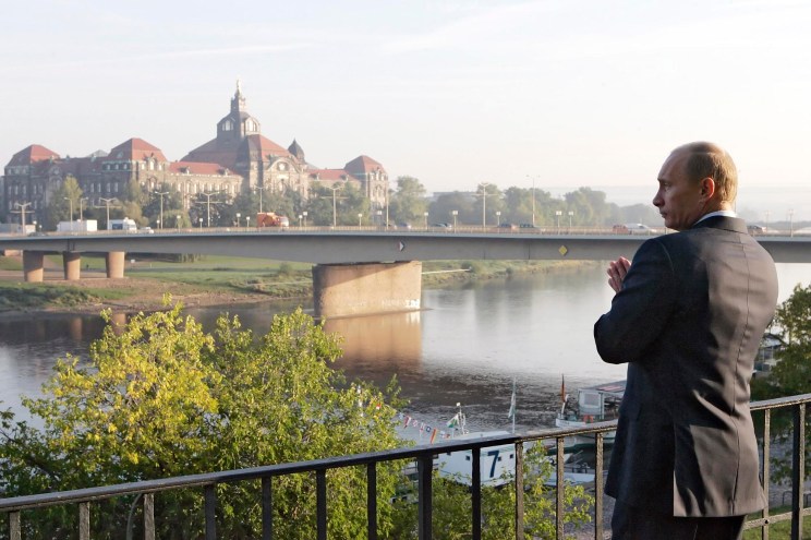 Vladimir Putin stands on the embankment of the Elbe River during sightseeing of Dresden, Germany on Dec. 6, 2006.