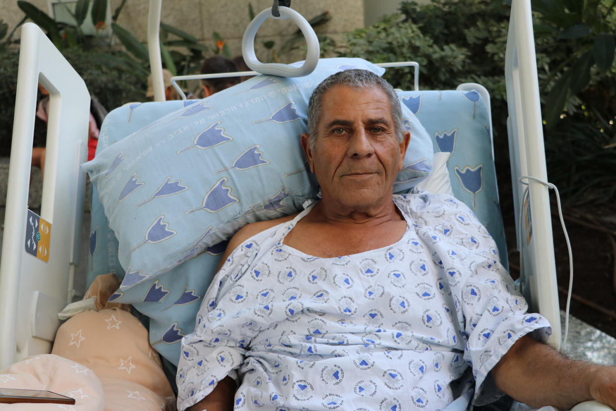 Adnan Aboubaker, 71, who was hospitalized after having a fall, lies on his hospital bed at the Tel Aviv Sourasky Medical Center on Thursday. (Chantal Da Silva)