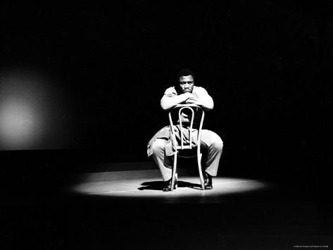 john-shearer-boxer-joe-frazier-sitting-on-a-chair-under-a-spotlight_i-G-27-2779-JVNTD00Z.jpg