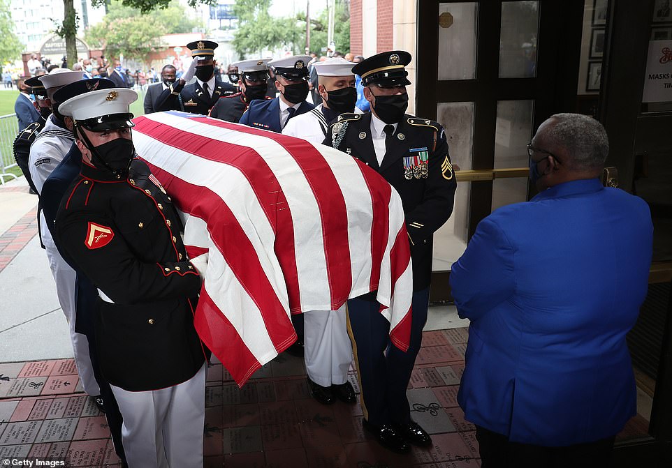 31375098-8576505-Lewis_casket_which_was_draped_in_a_US_flag_arrived_at_the_Ebenez-a-19_1596120741591.jpg
