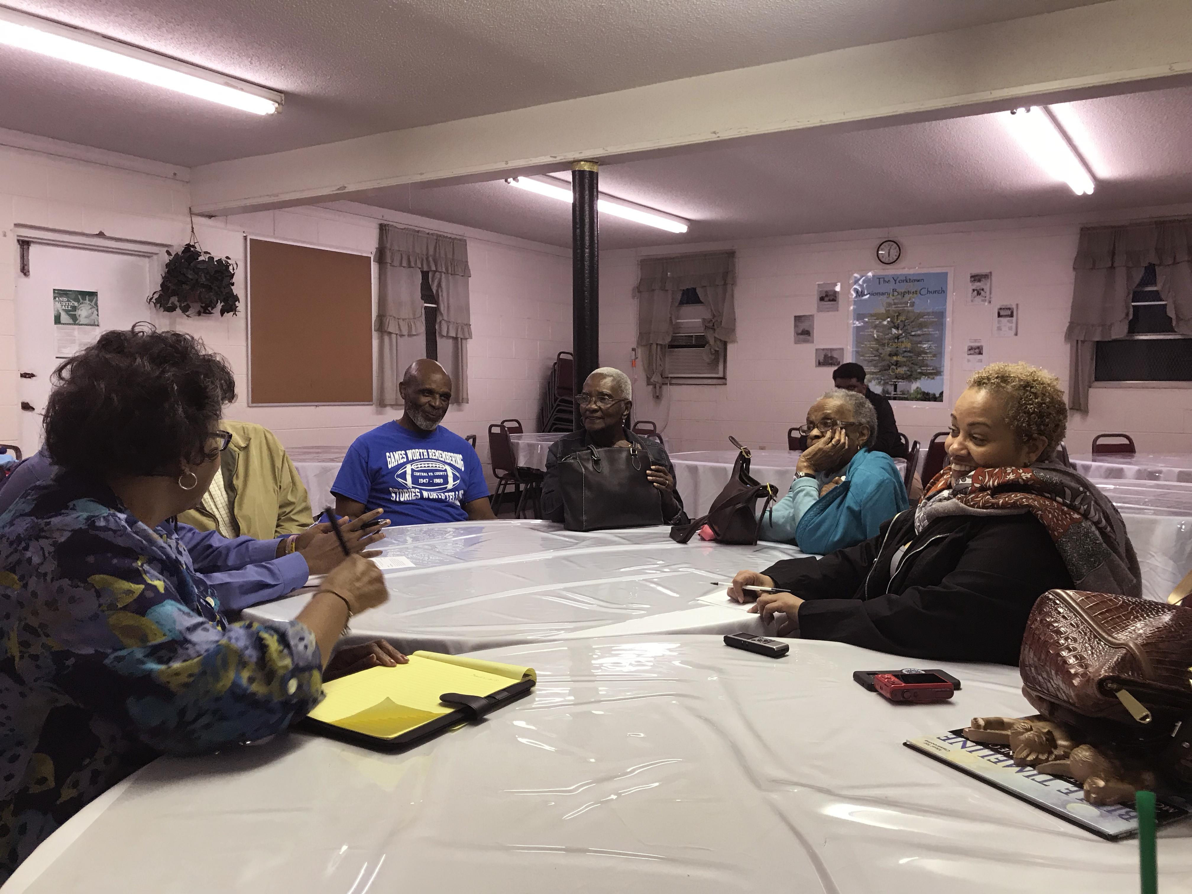 A group of descendants of Africatown meet with a curator from NMAAHC.