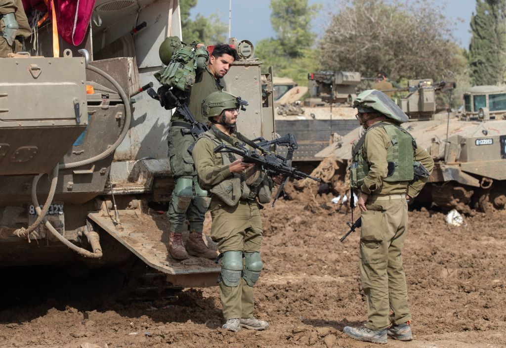 Israeli IDF reserve infantry soldiers standing in the Gaza Strip.