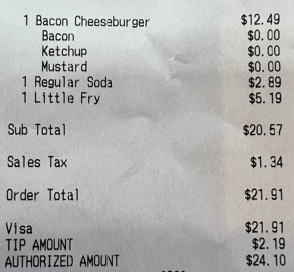 The Five Guys receipt is shown, where a cheese burger costed just $12.49 alone from everything else. 
