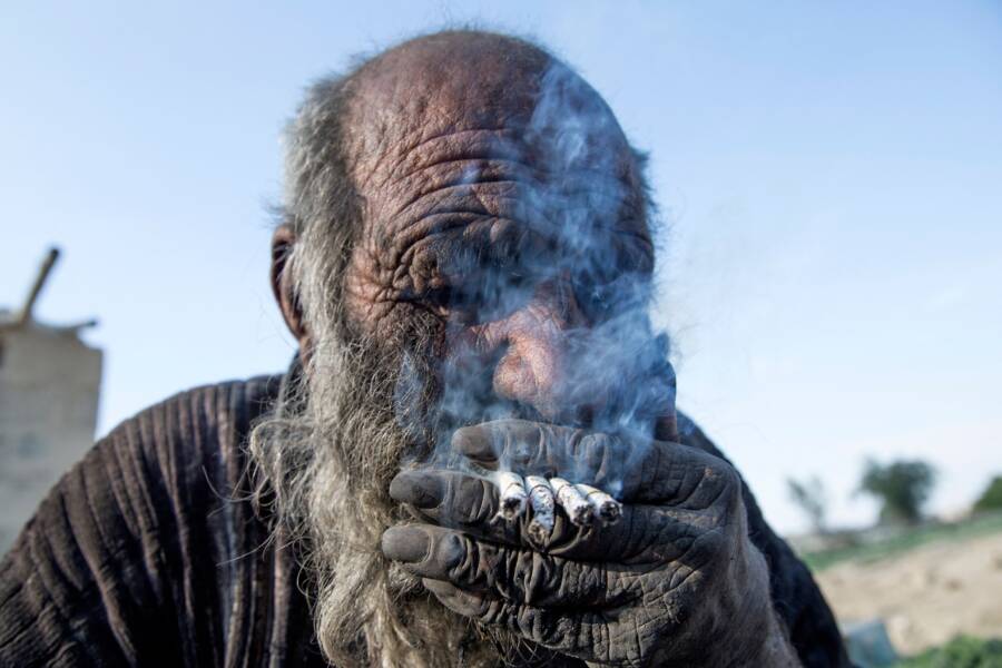 Amou Haji Smoking Cigarettes