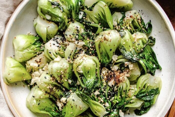 Stir-fried baby bok choy served in a big white plate