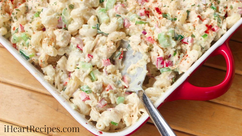 This creamy macaroni salad is served cold with chunks of chicken and vegetables.