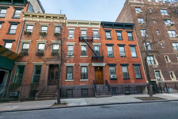 A red-brick apartment building in Manhattan.