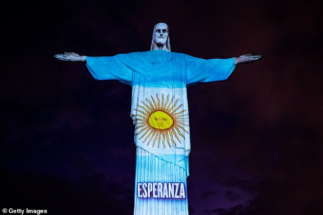 27139278-8214575-A_view_of_the_illuminated_statue_of_Christ_the_Redeemer_that_rea-a-13_1586802587313.jpg