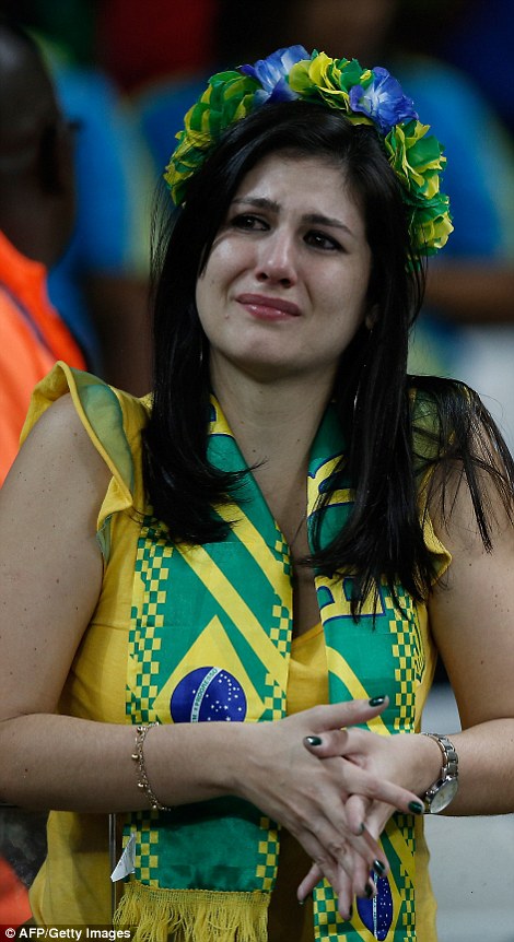 1404859585705_wps_20_A_Brazilian_fan_reacts_at.jpg