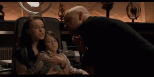 a bald man is screaming at another bald man with the words wrong written on the bottom of the image .