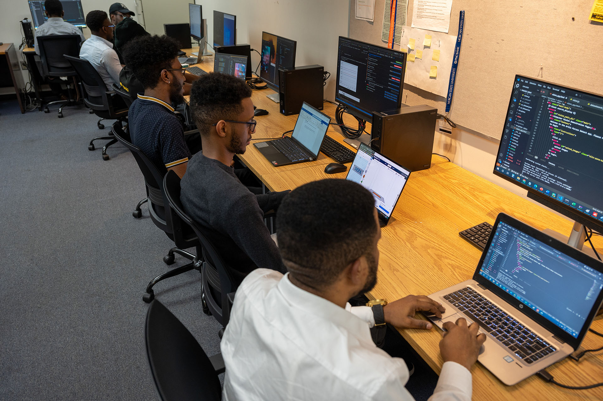 A group of students working in the Data Engineering and Predictive Analytics Research Lab