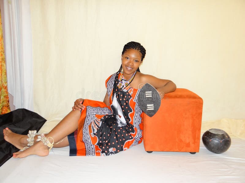 swazi-woman-traditional-attire-sitting-44723333.jpg