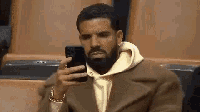 drake-phone-drake-mad-looking-at-phone.gif