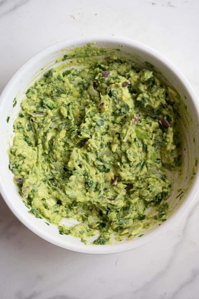 Fresh guacamole in a bowl.