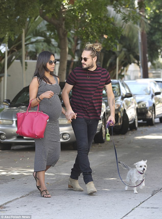 1414584783980_wps_5_Zoe_Saldana_and_husband_M.jpg