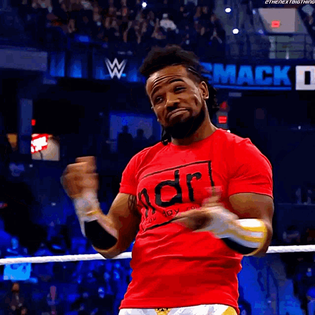 king-xavier-woods-shrug.gif