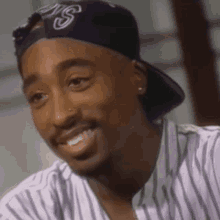 tupac-laughing.gif