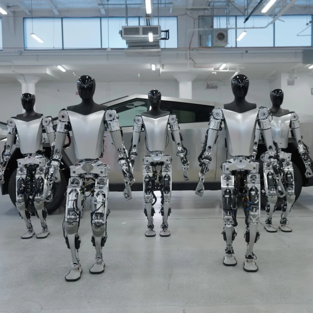 tesla-optimus-humanoid-robots-walking.webp