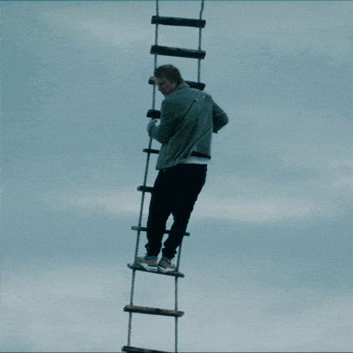 climbing-the-rope-ladder-ed-sheeran.gif