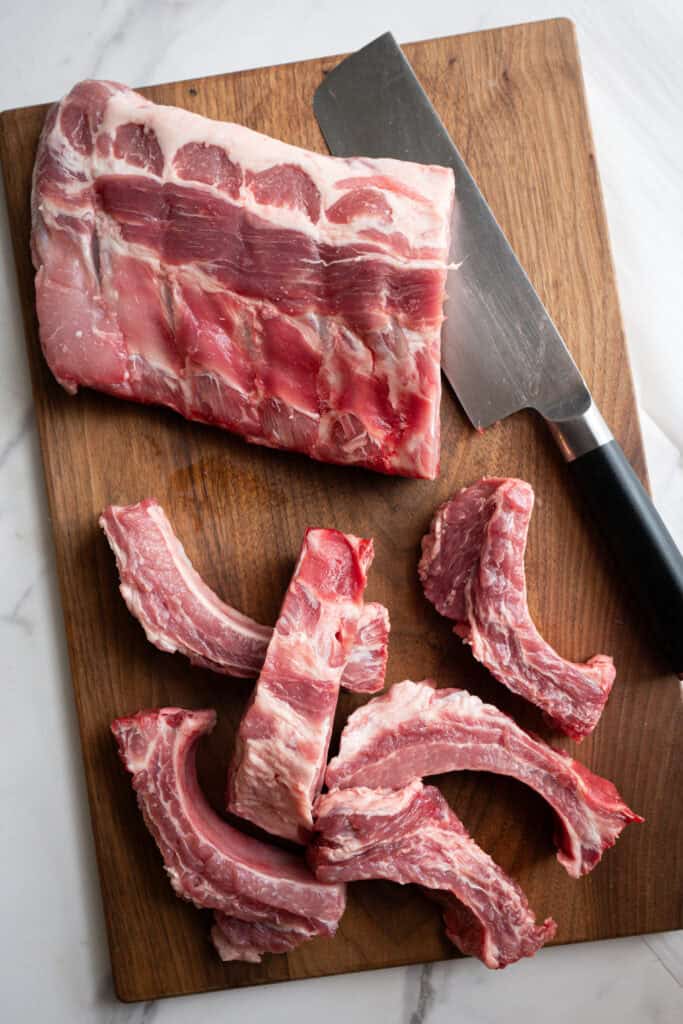 pork ribs being cut up