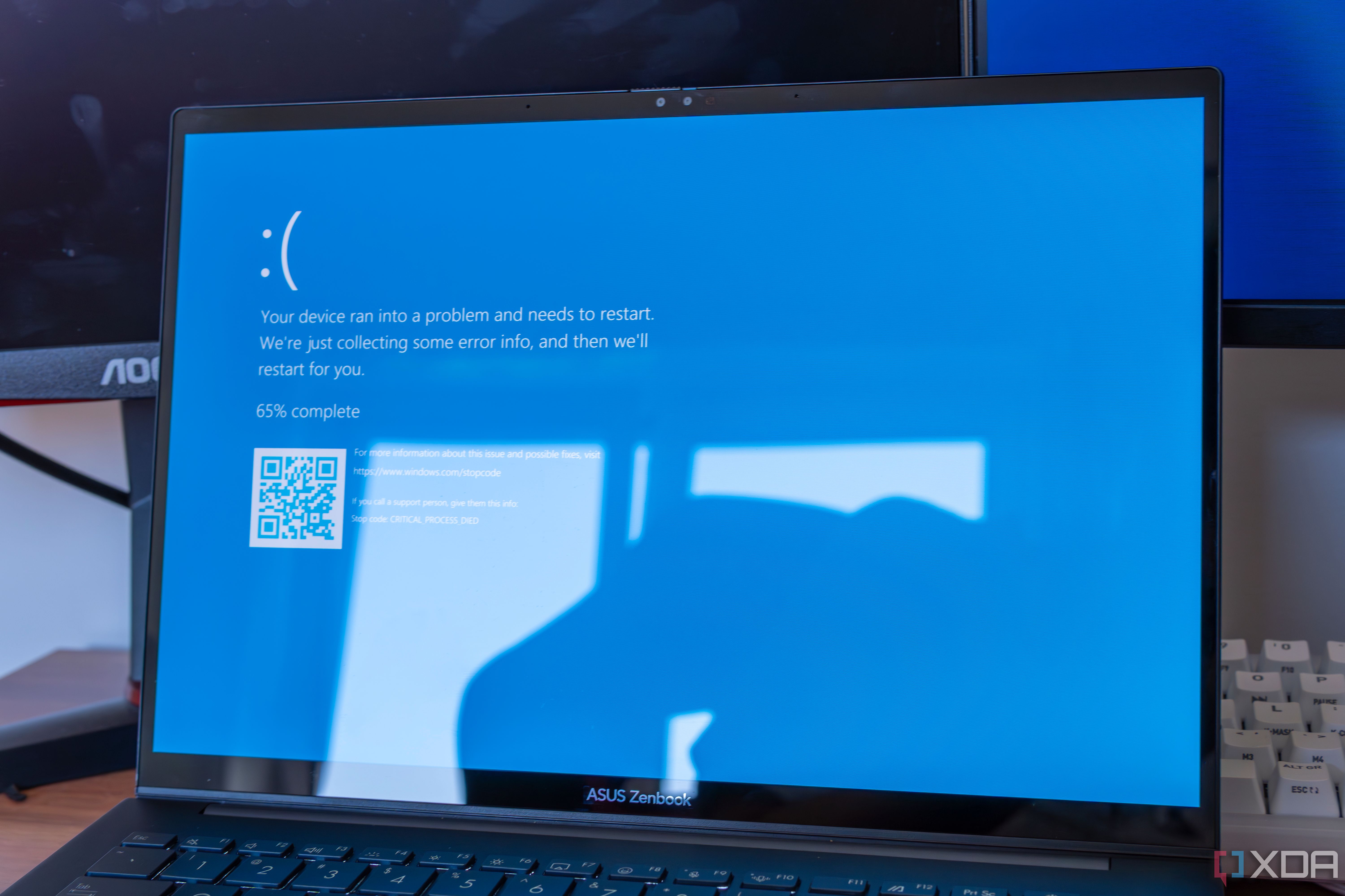 A laptop showing a Blue Screen of Death