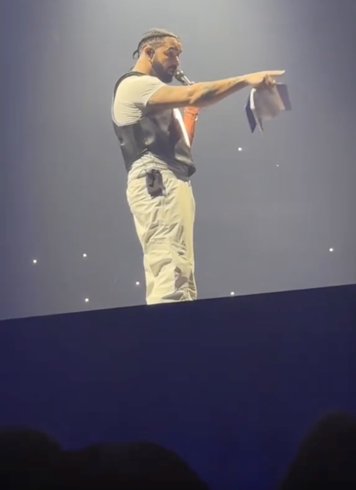 Drake issued a warning to a fan after a book was thrown at him on stage.