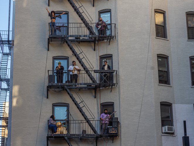 Photos from a live balcony concert in Harlem in September 2021