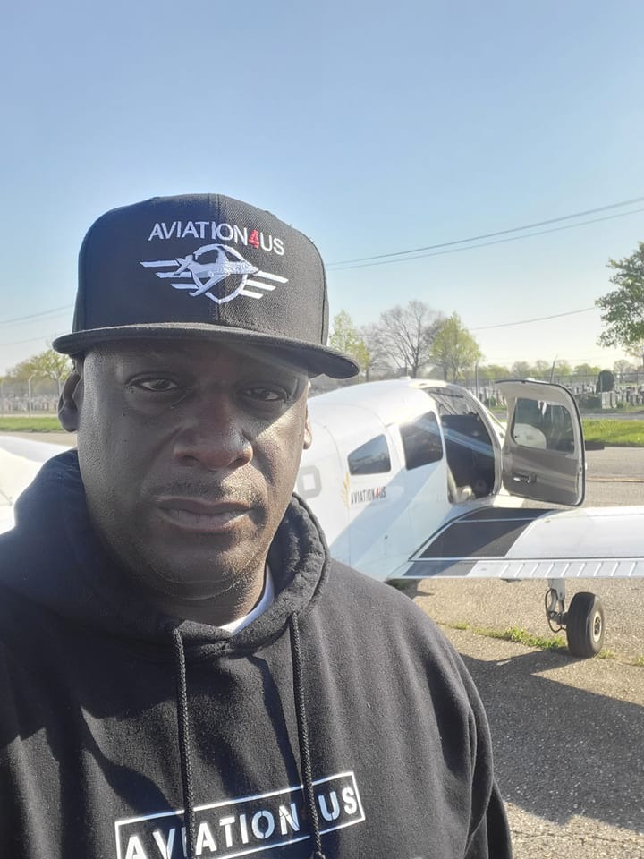 Winston Faison, NYPD Aviation Unit CO, standing near a small plane.