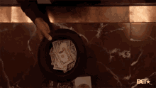 pass-the-hat-dollar-bills.gif