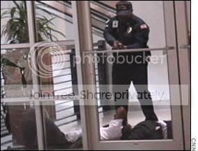 Officer-covers-suspect200.jpg
