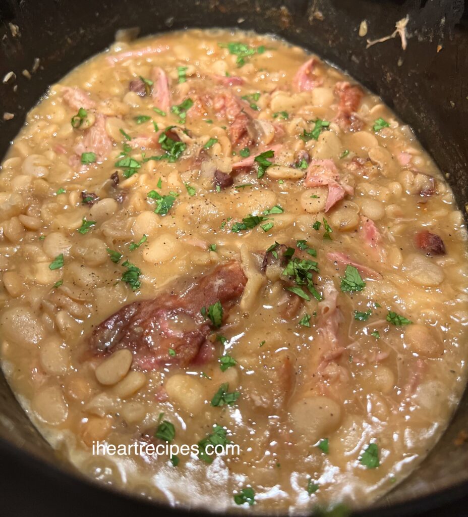 Golden beans and savory turkey in a seasoned broth garnished with fresh parsley. 