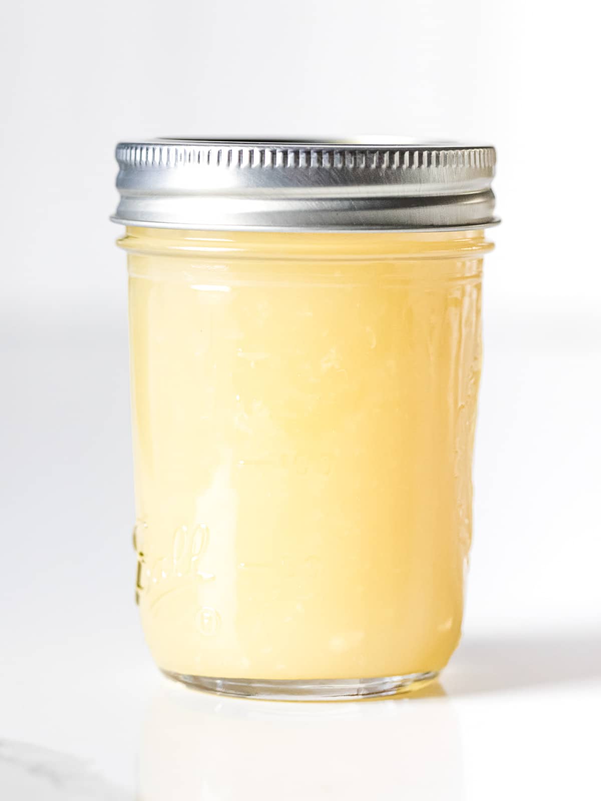 Chinese white stir fry sauce in a glass mason jar with lid