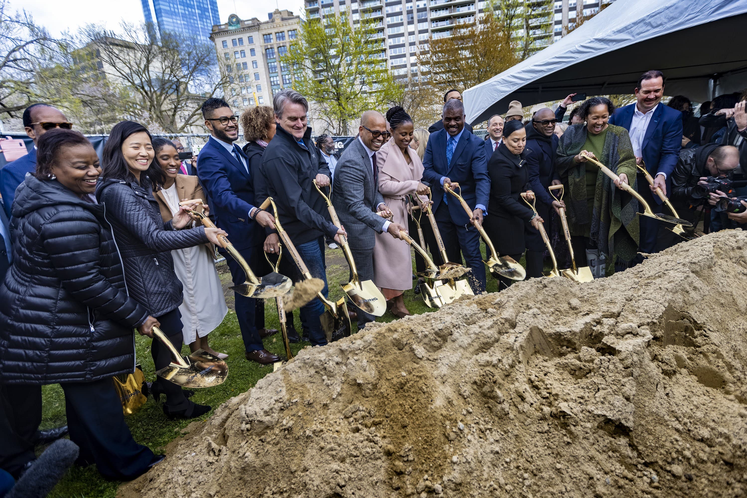 Local politicians, dignitaries and founding members of King Boston ceremoniously break ground for the King Boston memorial, The Embrace, at the Boston Common. (Jesse Costa/WBUR)