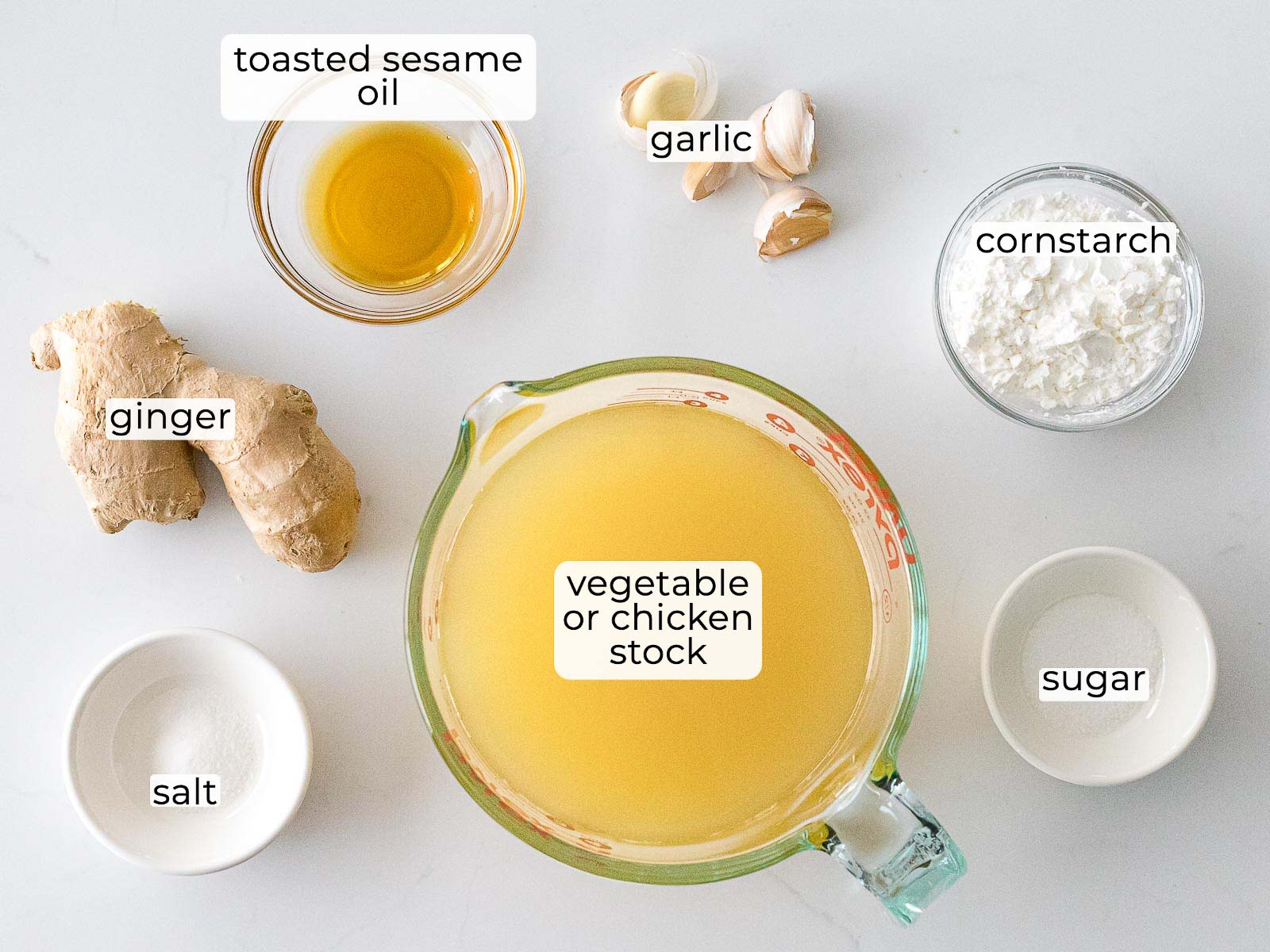 Chinese white sauce ingredients in glass bowls with text label overlays