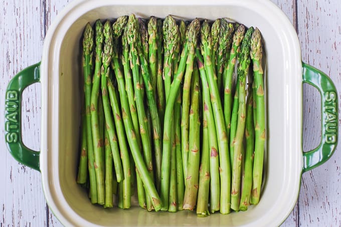 Trimmed fresh asparagus in a casserole dish