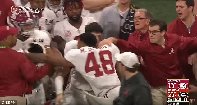 483237B400000578-0-Brown_48_is_seen_above_attempting_to_punch_an_assistant_coach_du-a-44_1516120619148.jpg