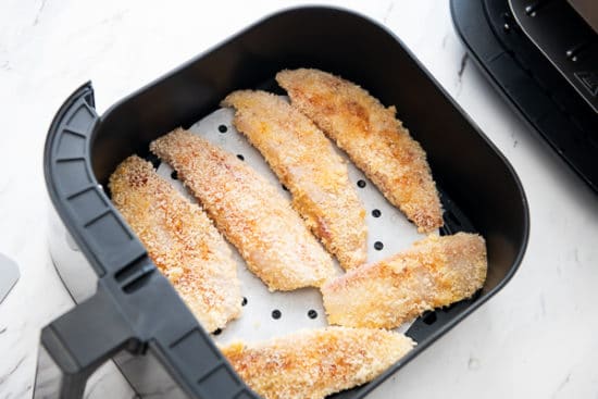 Putting fish in a single layer in the air fryer