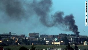 Smoke billows from targets in Tel Abyad, Syria, during bombardment by Turkish forces, on Friday, October 11.