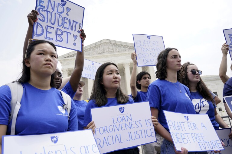 FILE - People demonstrate outside the Supreme Court, June 30, 2023, in Washington. A group of Republican-led states filed a federal lawsuit Thursday, March 28, 2024, suing the Biden administration to block a new student loan repayment plan that provides a faster path to cancellation and lower monthly payments for millions of borrowers. (AP Photo/Jacquelyn Martin)