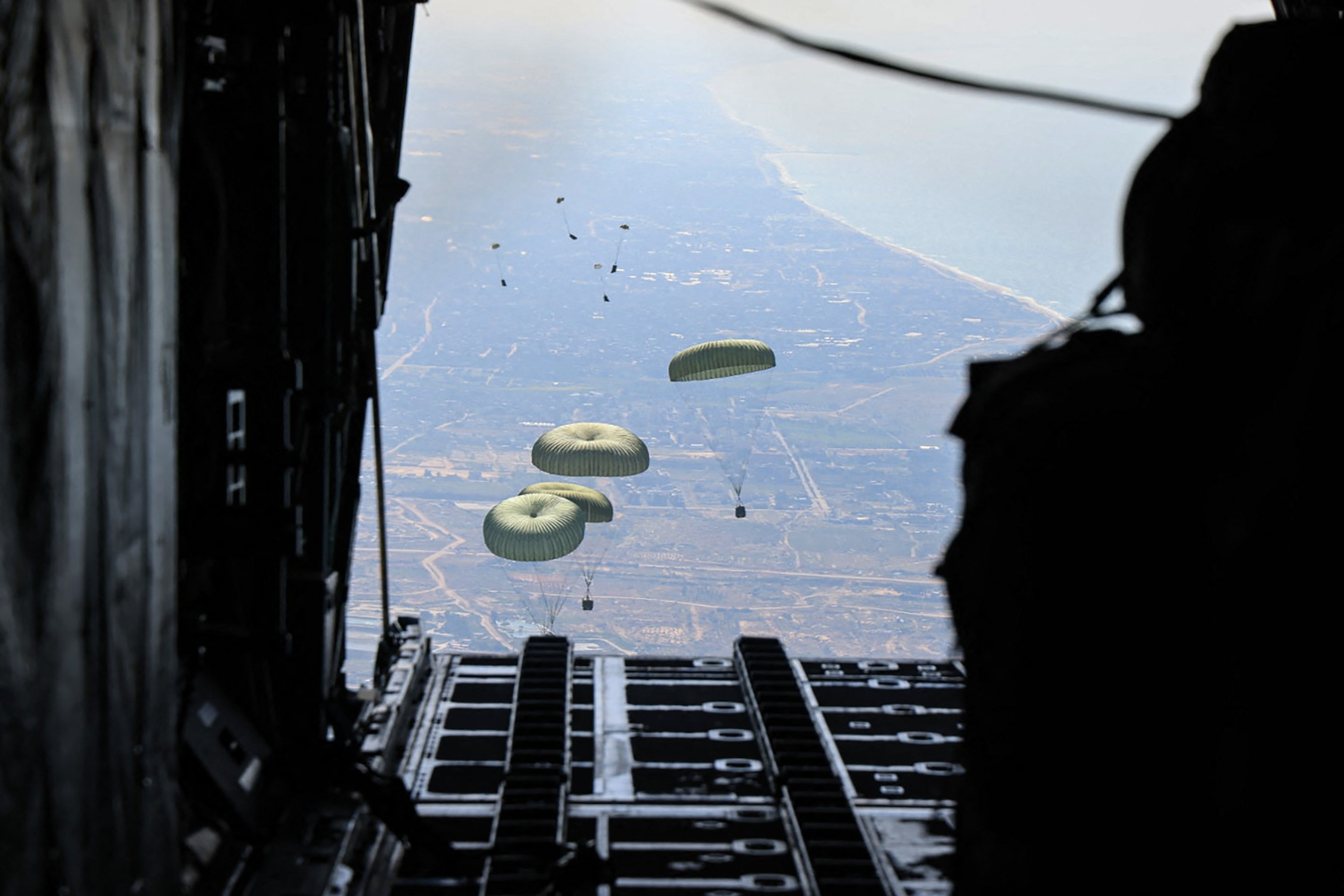 PHOTO: Humanitarian aid being airdropped from a military aircraft over the Gaza Strip, March 11, 2024.