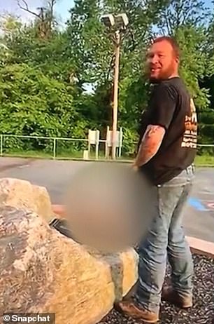 13726136-7050267-The_footage_shows_a_man_allegedly_urinating_on_a_memorial_for_a_-a-15_1558370006961.jpg
