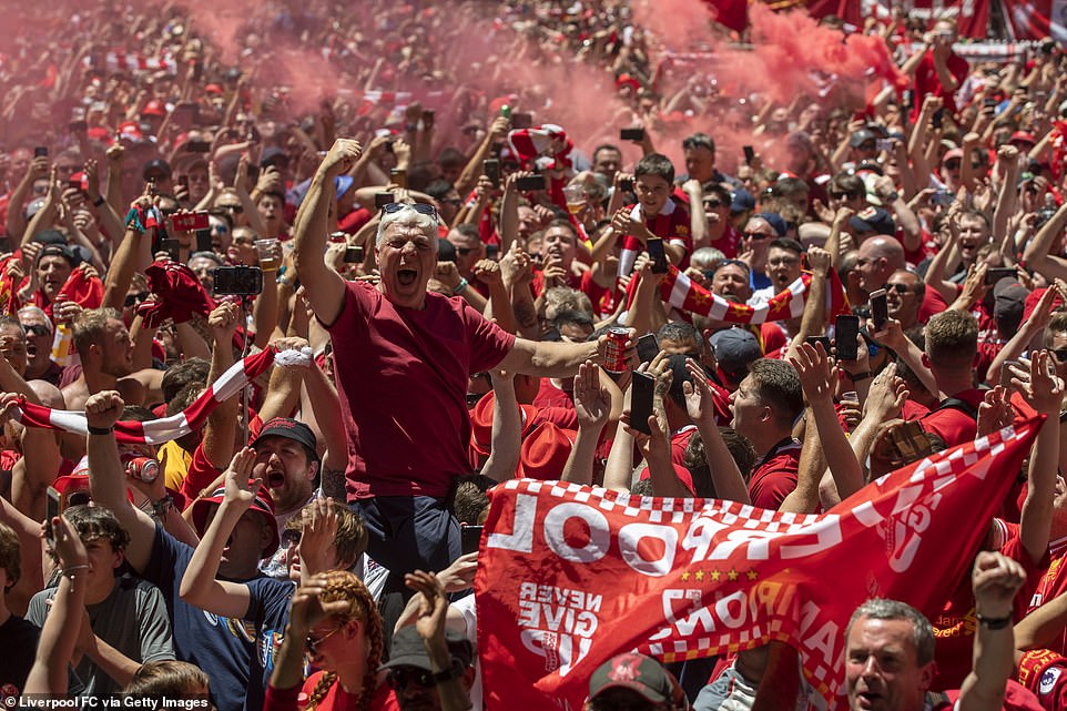 14232852-7093691-Liverpool_FC_fans_enjoy_the_atmosphere_at_Liverpool_Fan_Park_ahe-a-7_1559406929517.jpg