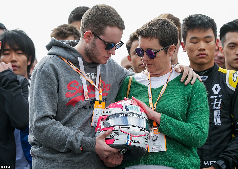 17934516-7416213-The_brother_and_mother_of_Anthoine_Hubert_held_his_helmet_during-a-18_1567341753151.jpg