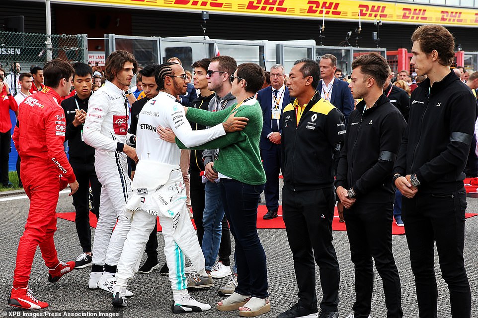 17939136-7416213-Lewis_Hamilton_pictured_with_Hubert_s_family_today_has_led_a_min-a-7_1567355658994.jpg