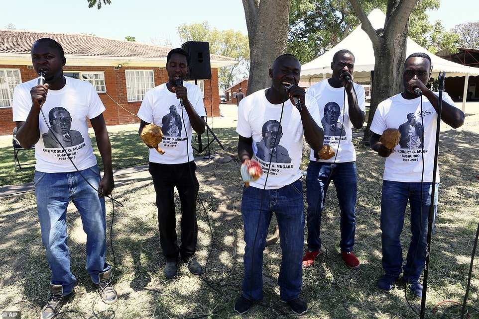 19042924-7514931-A_choral_group_performs_at_a_mass_for_former_Zimbabwean_Presiden-a-49_1569675691049.jpg