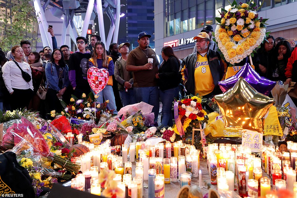 23961294-7936515-Mourners_gather_at_a_makeshift_memorial_for_Kobe_Bryant_outside_-a-89_1580182159125.jpg