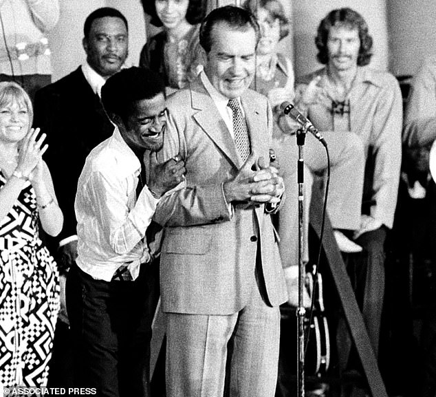 25017770-8028731-Sammy_Davis_can_be_seen_hugging_US_President_Richard_Nixon_at_a_-a-17_1582302642589.jpg