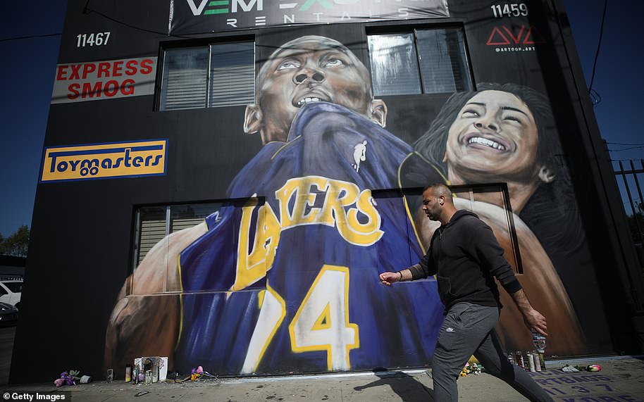 25130876-8038635-A_mural_depicting_deceased_NBA_star_Kobe_Bryant_and_his_daughter-a-15_1582564135353.jpg