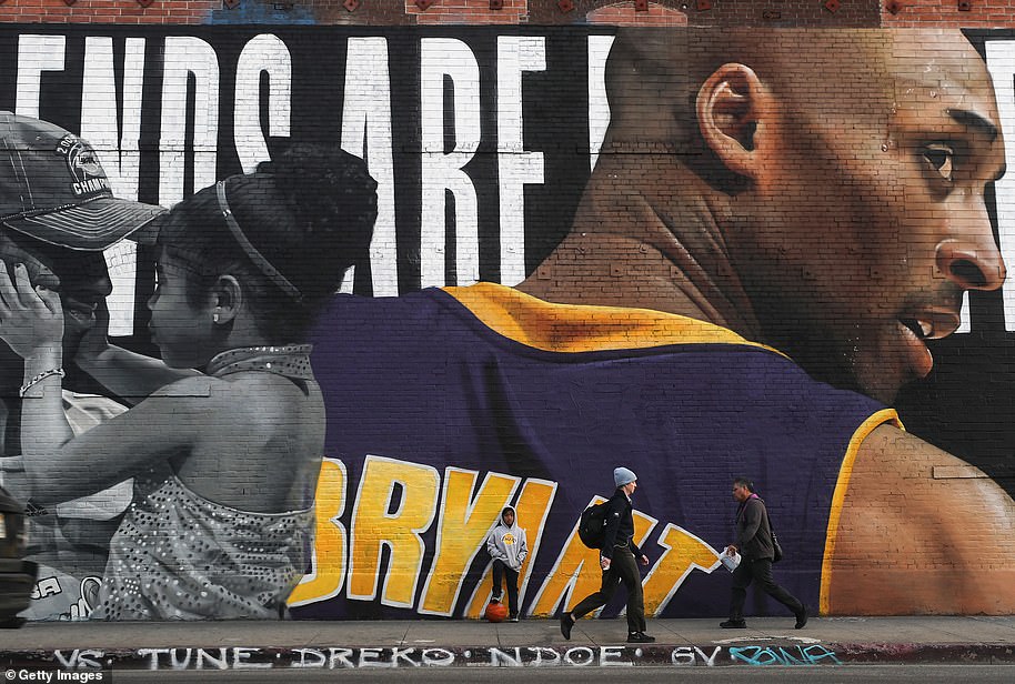 25130878-8038635-A_mural_depicting_deceased_NBA_star_Kobe_Bryant_and_his_13_year_-a-16_1582564135357.jpg